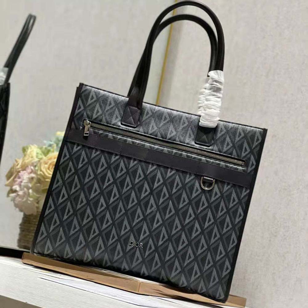 Close-up detail of silver-tone CD hardware on Dior Men Safari Tote Bag