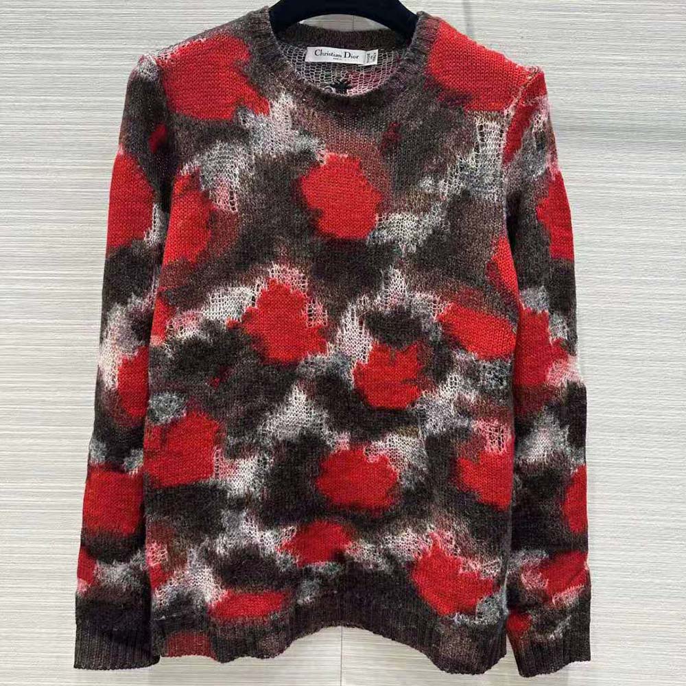 Close-up of Dior roses motif on red Dior Men Sweater knit