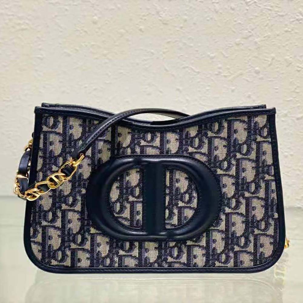Close-up of silver-tone CD hardware on Dior Women CD Signature Hobo Mini Bag
