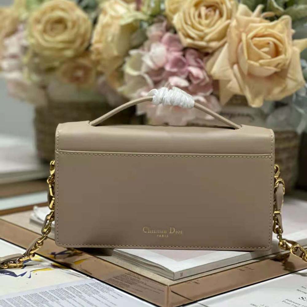 Side profile showing adjustable strap of Dior Women CD Signature Mini Bag