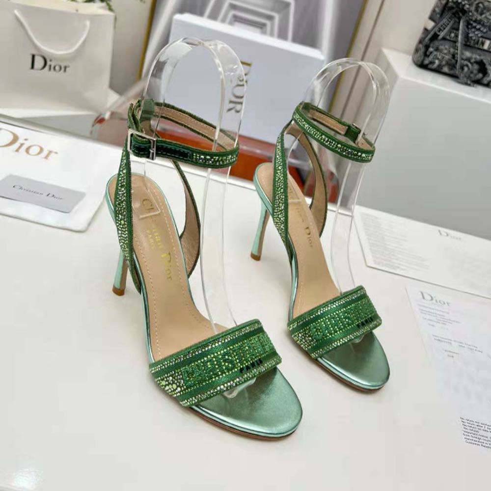 Top angle highlighting green cotton upper and heeled silhouette of Dior Women Dway Heeled Slide