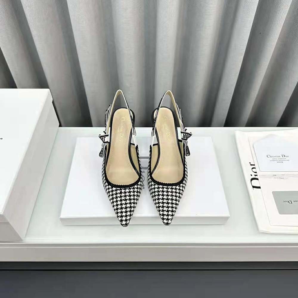 Close-up of signature Dior logo on heel tab of J’Adior Slingback Pump