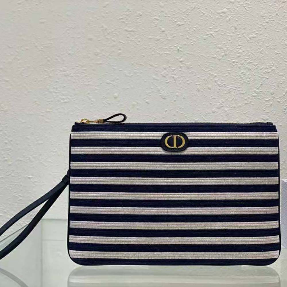 Close-up on silver Dior hardware detailing on large Dior Caro Ddaily Pouch