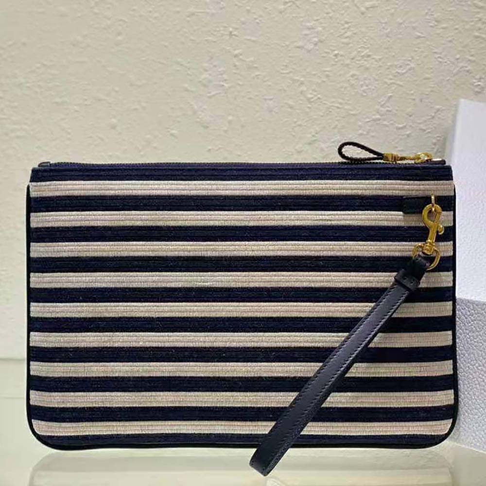 Side angle showing natural raffia texture on Dior Women Large Dior Caro Ddaily Pouch