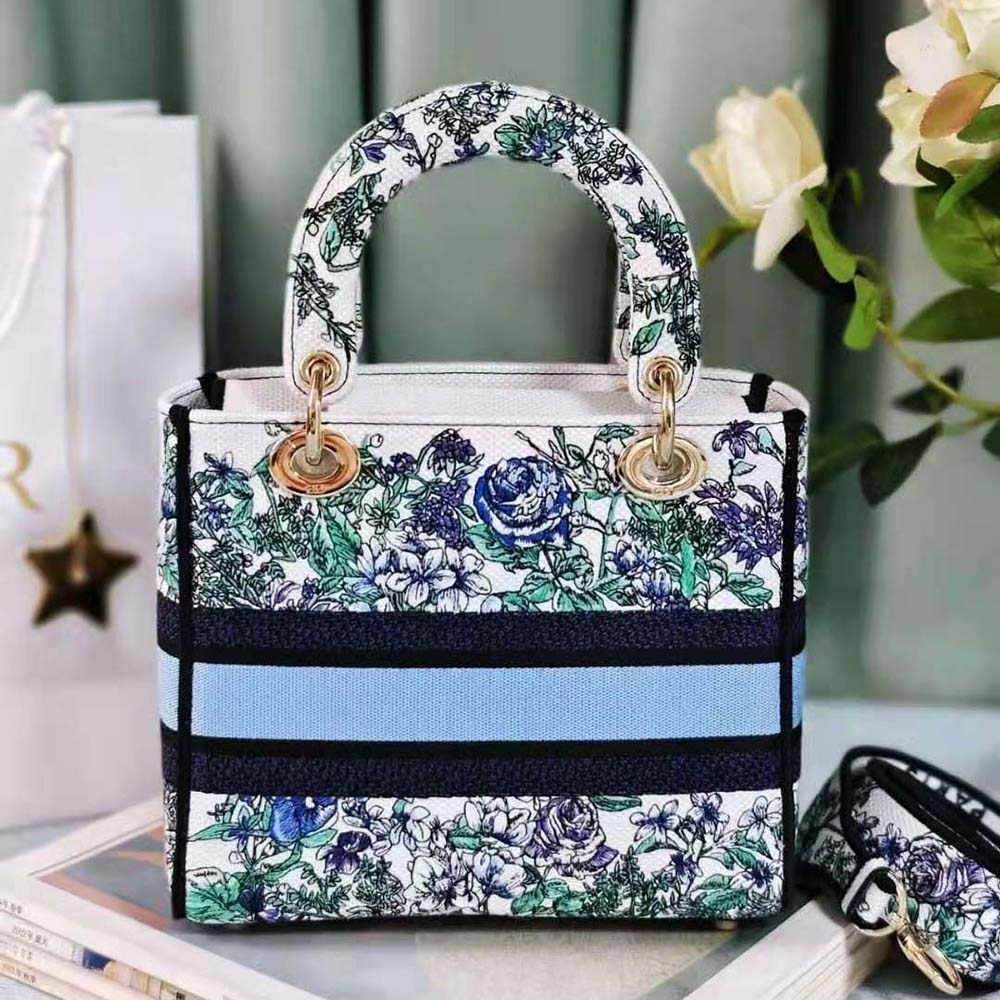 Side angle showing silver hardware and structured silhouette of Lady D-Lite bag