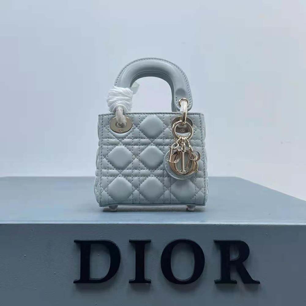 Side angle highlighting silver hardware on Dior Women Mini Lady Dior Bag
