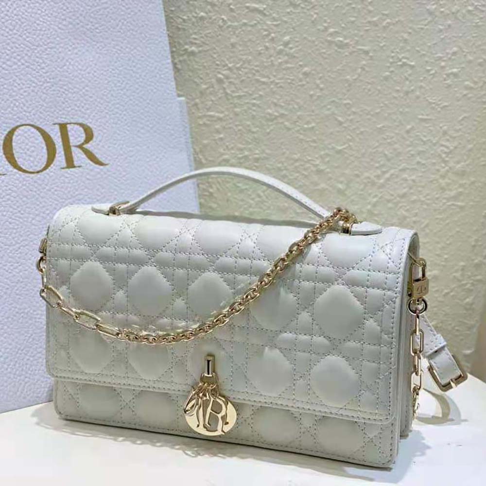Side angle showcasing the structured silhouette of Dior Women Miss Dior Top Handle Bag