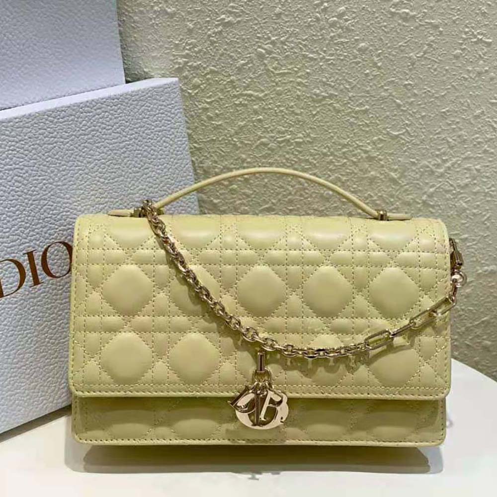 Close-up of Dior signature Cannage stitching on pastel yellow lambskin bag