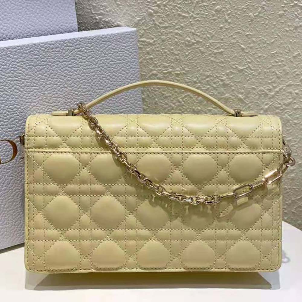 Side angle showing silver hardware on Dior Women Miss Dior Top Handle Bag