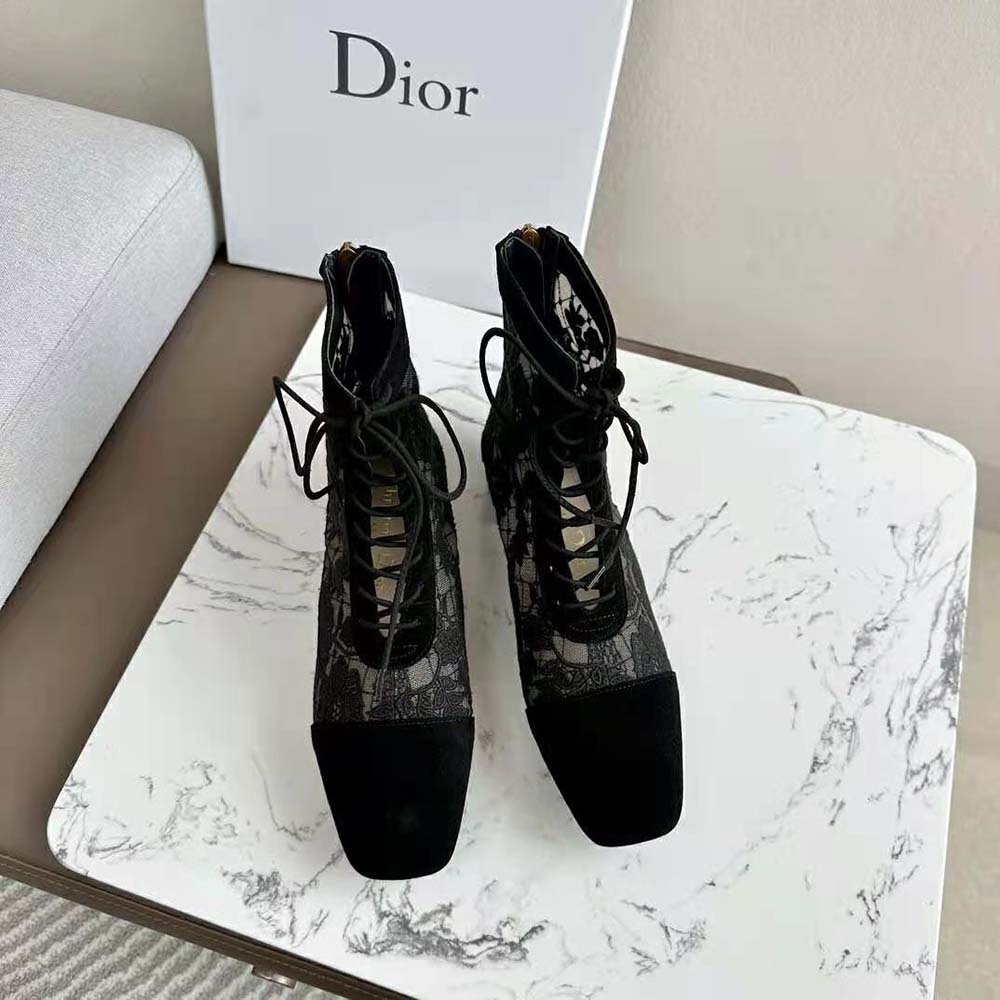 Close-up on black suede and floral embroidery of Dior Women Naughtily-d Ankle Boot