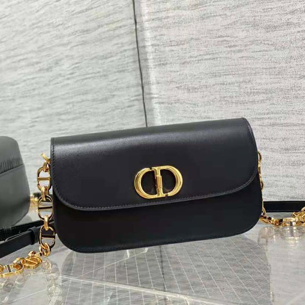 Close-up of silver 30 Montaigne hardware on black Dior women’s shoulder bag