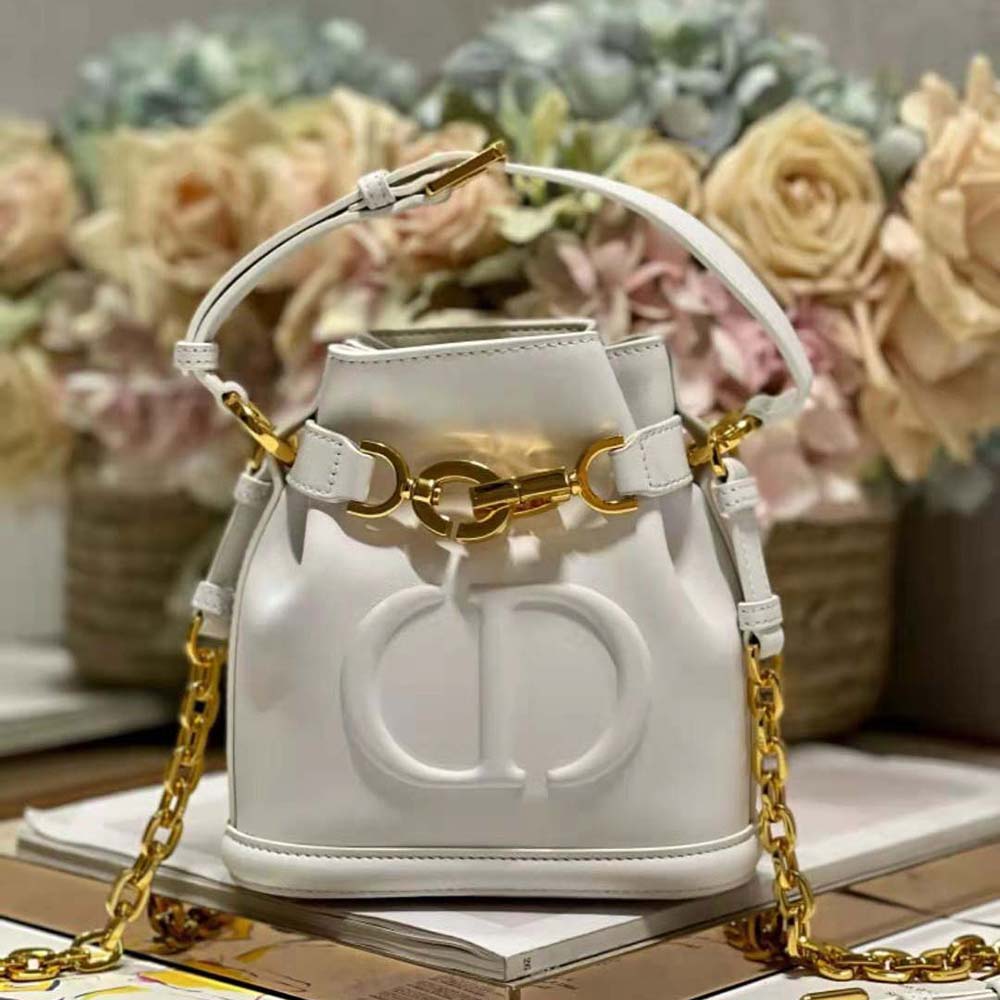 Close-up of silver hardware and white calfskin on Dior Women Small C’est Dior Bag Latte