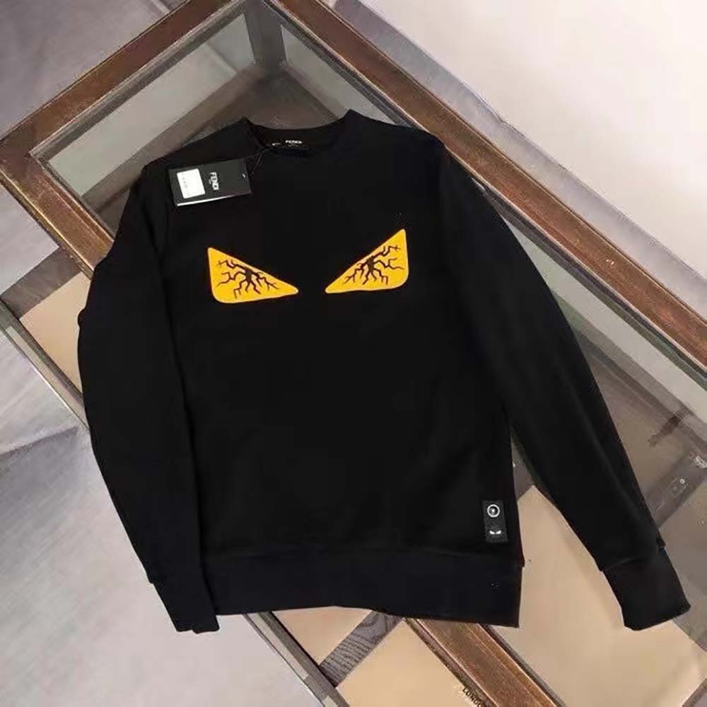 Close-up detail of wool texture and Fendi logo on sleeve