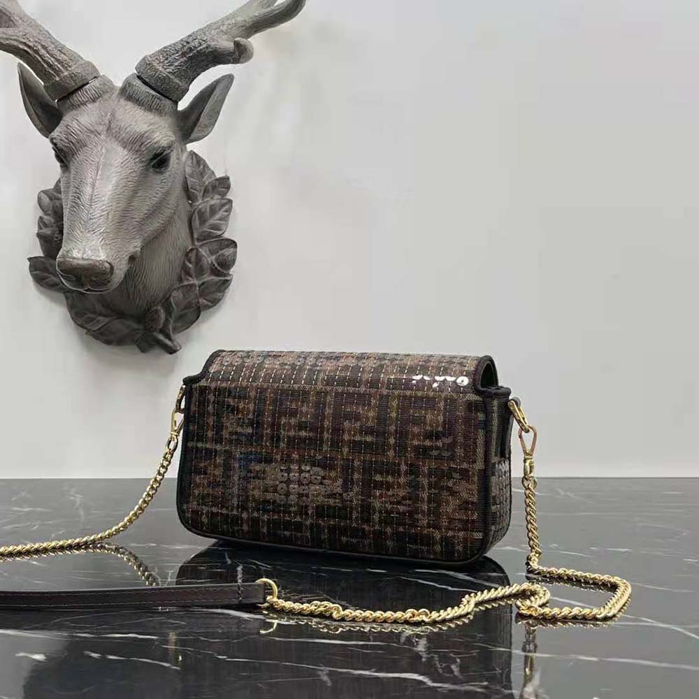 Side angle showing compact silhouette of Fendi Women Baguette Mini Brown Bag