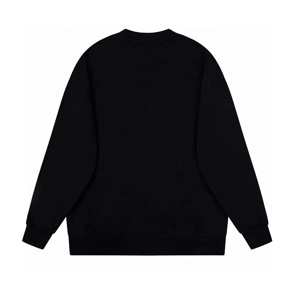 Close-up of Fendi logo detail on black wool sweater sleeve