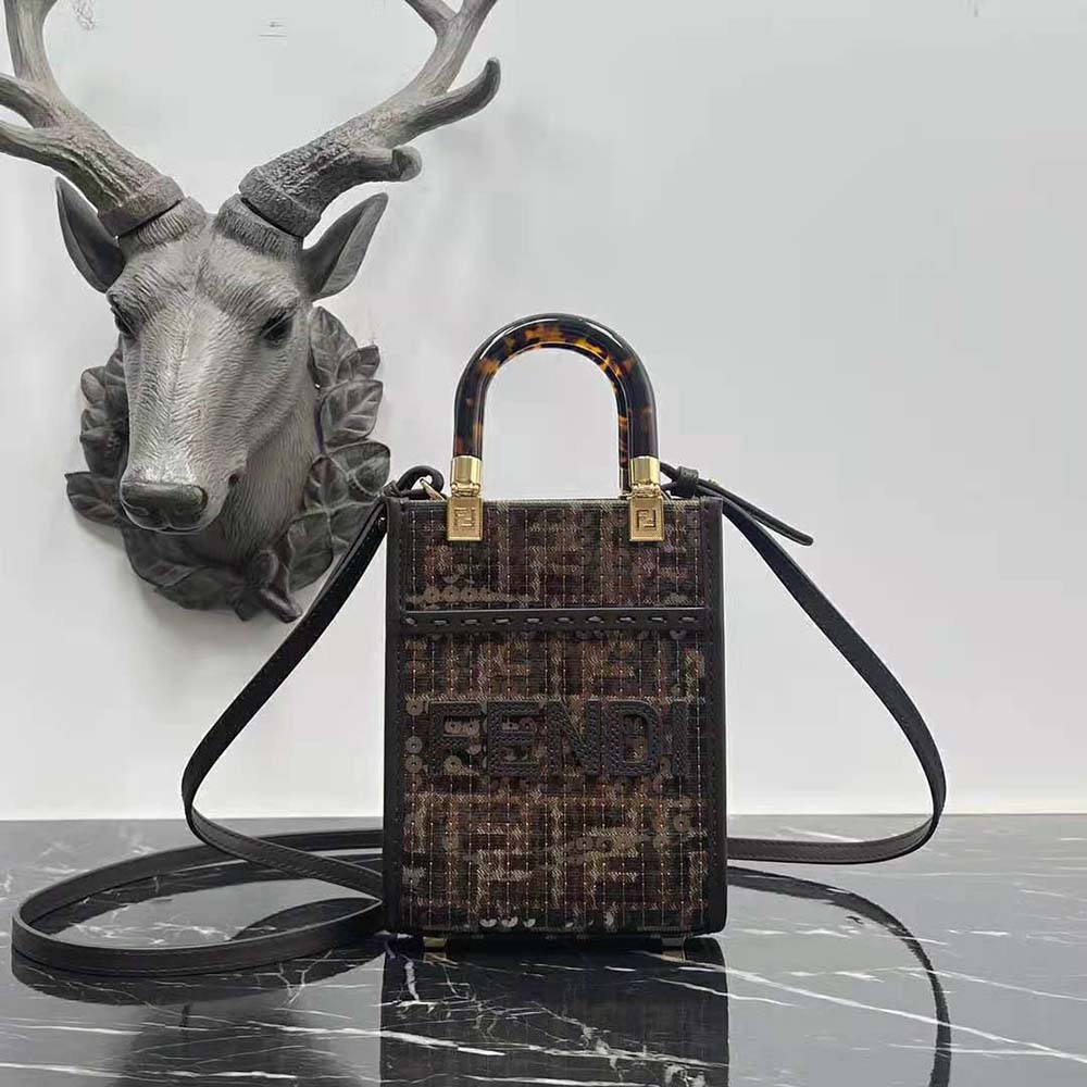 Close-up of gold-tone hardware and sequin detail on Fendi mini shopper