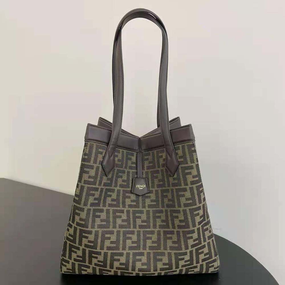 Close-up of FF jacquard fabric and gold hardware on Fendi bag