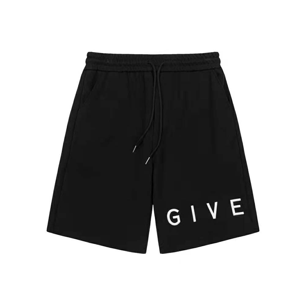 Close-up of Givenchy logo hardware on blue fleece shorts