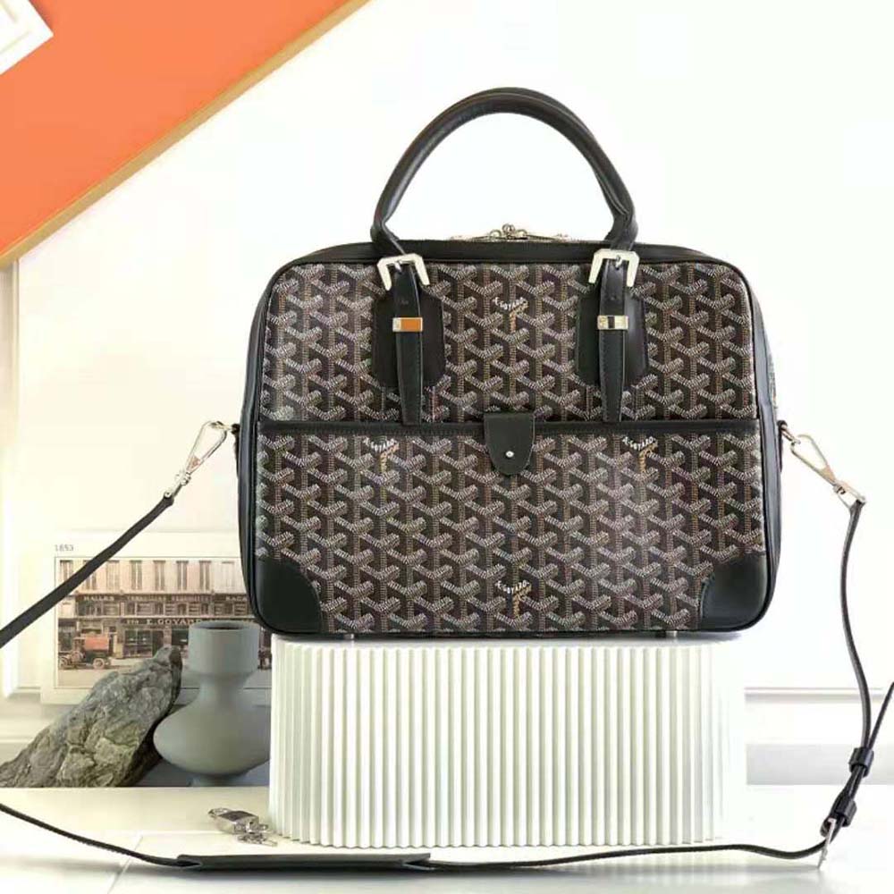 Close-up of black coated canvas and silver zipper on Goyard document case