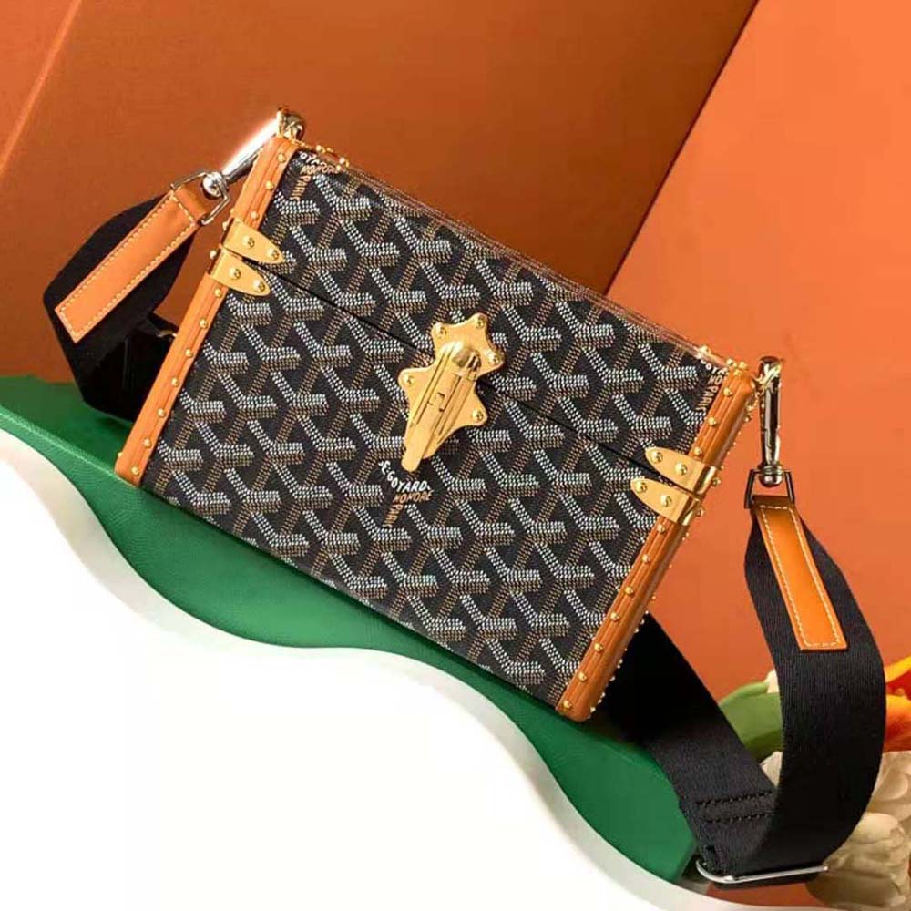Close-up detail of Goyardine canvas and Clamecy cowhide on Goyard Women Cassette Trunk Bag
