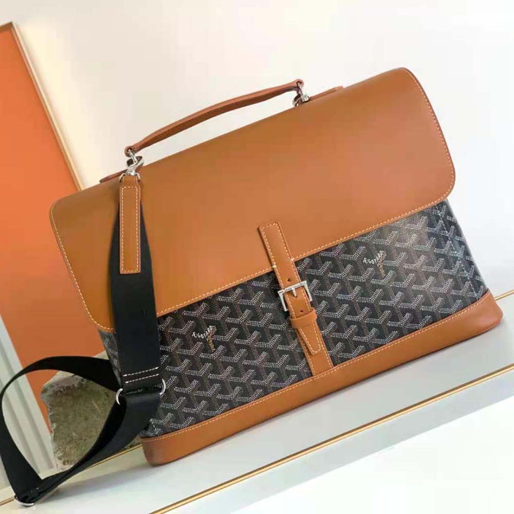 Close-up of signature hand-painted chevron detail on Goyard messenger bag