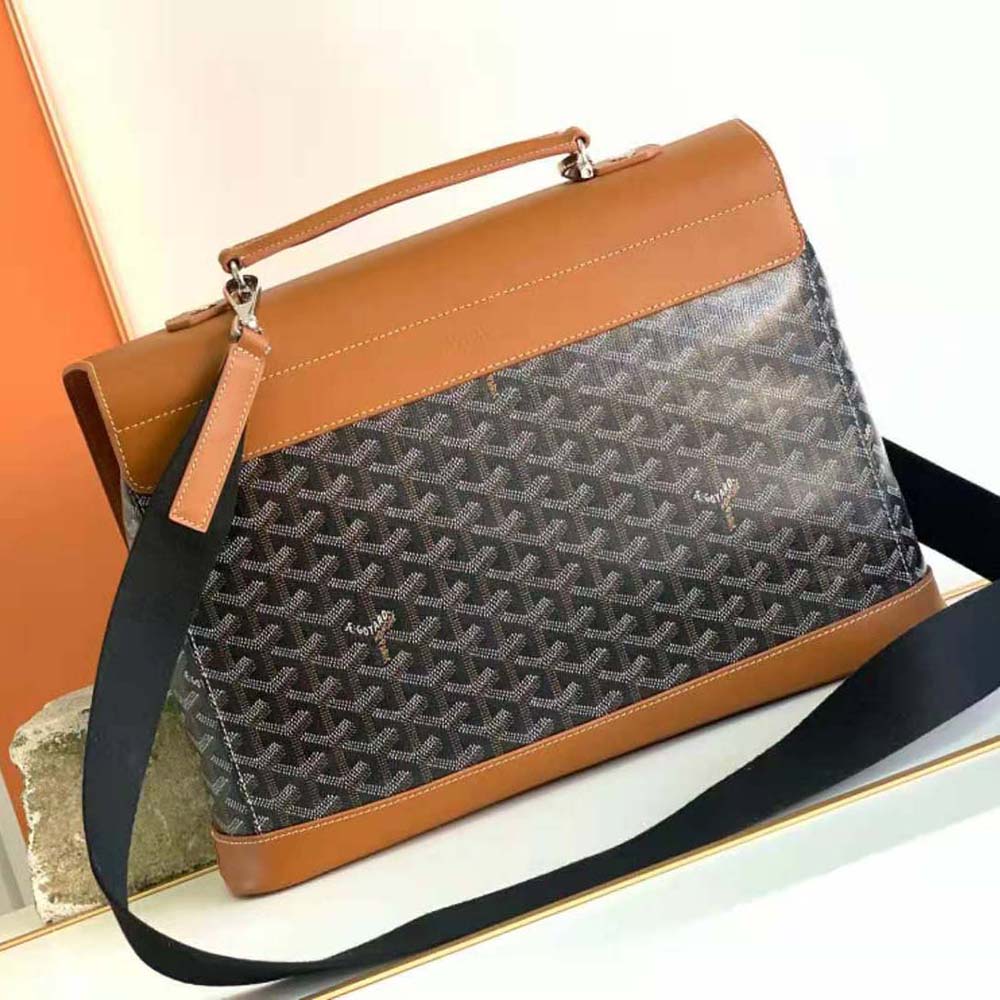 Side profile showing brass hardware and leather trim of Goyard Citadin PM