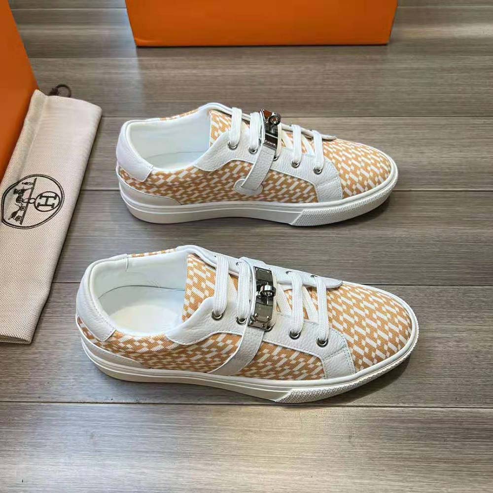 Close-up of white calfskin and laces on Hermes Women Free Sneaker