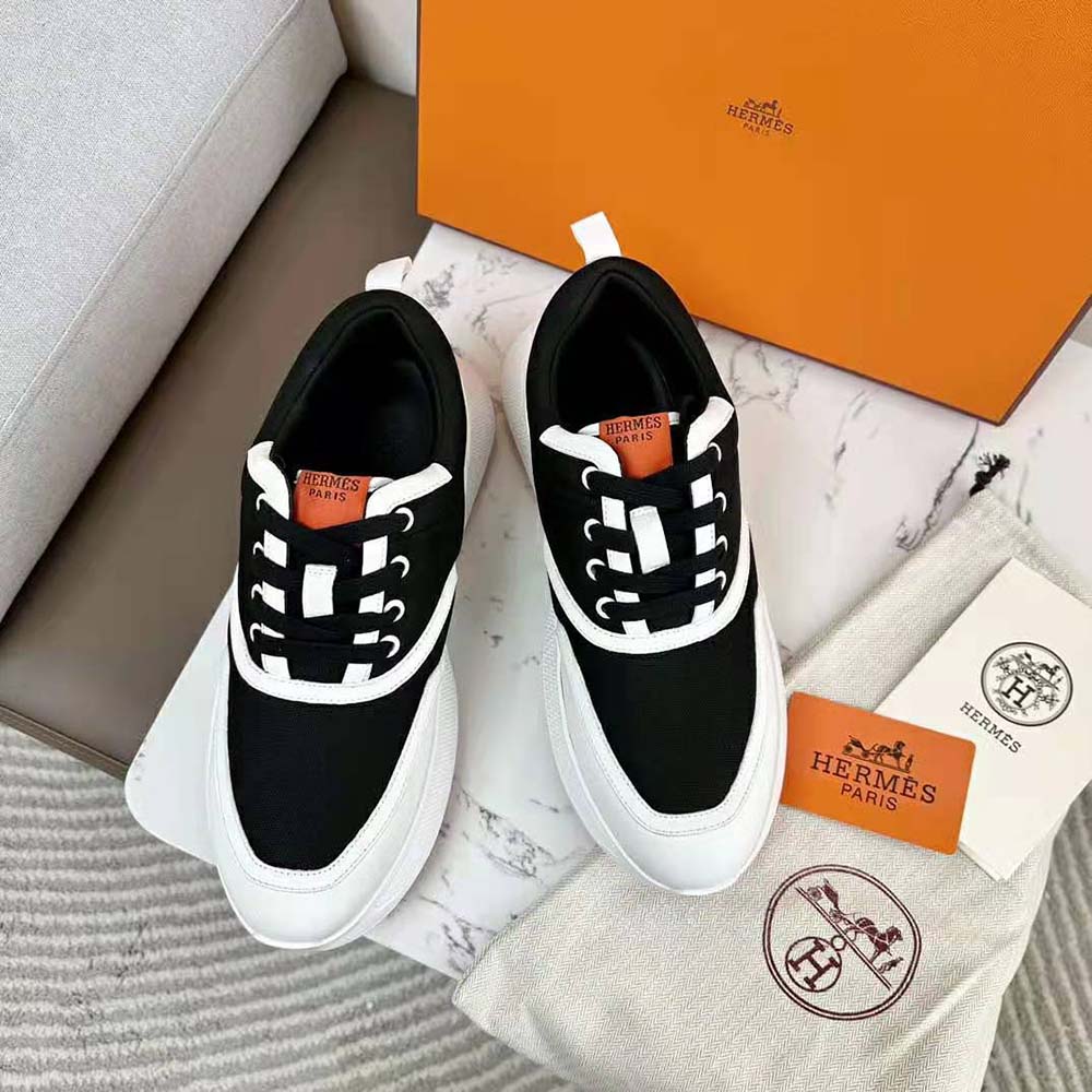 Close-up detail of black calfskin and mesh on Hermes Women Giga Sneaker