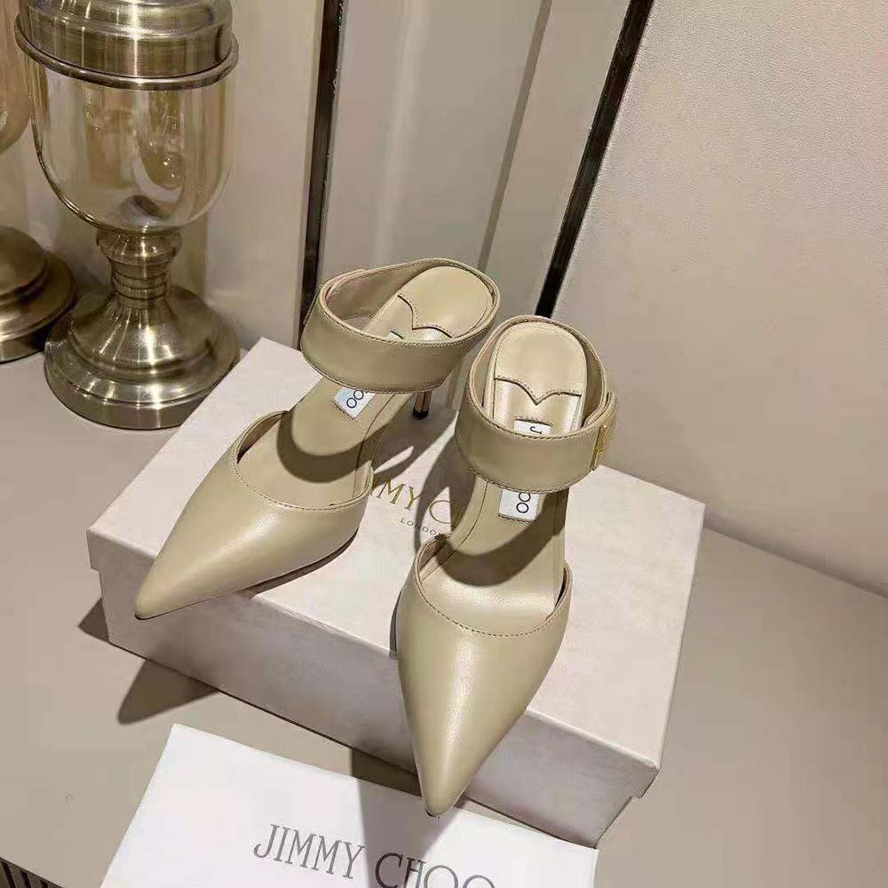 Close-up of gold signature detail on Jimmy Choo Women Nell Mule 85