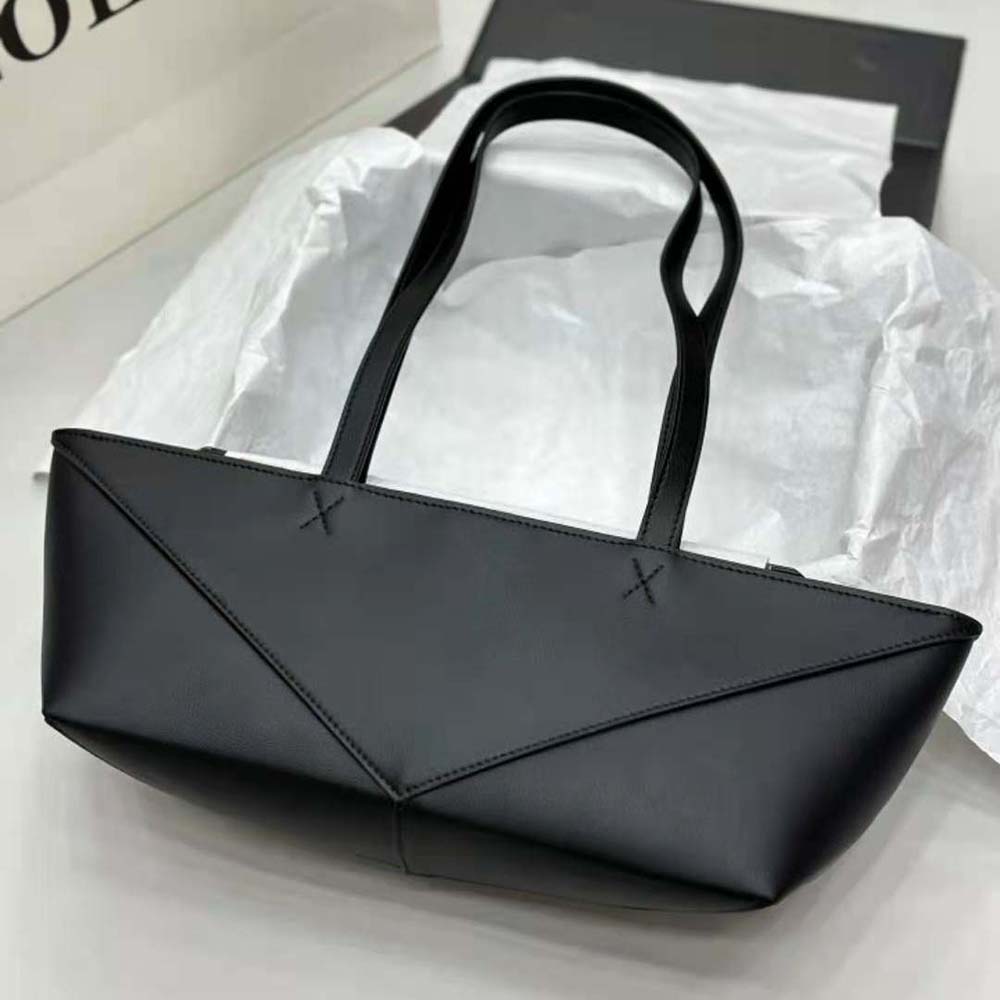 Side profile showing compact silhouette of Loewe Women Cropped Puzzle Fold Bag