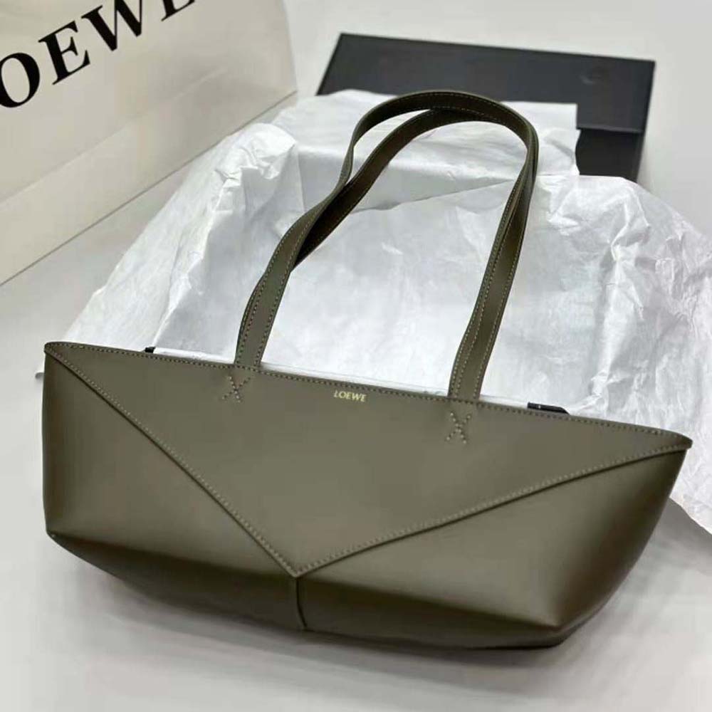 Side angle showcasing compact silhouette of Loewe Women Cropped Puzzle Fold Bag