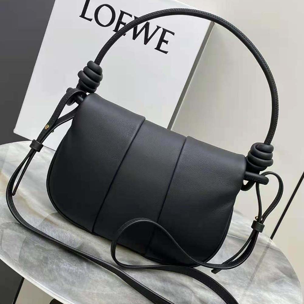 Side profile showcasing sleek silhouette of Loewe Women Paseo Satchel in black