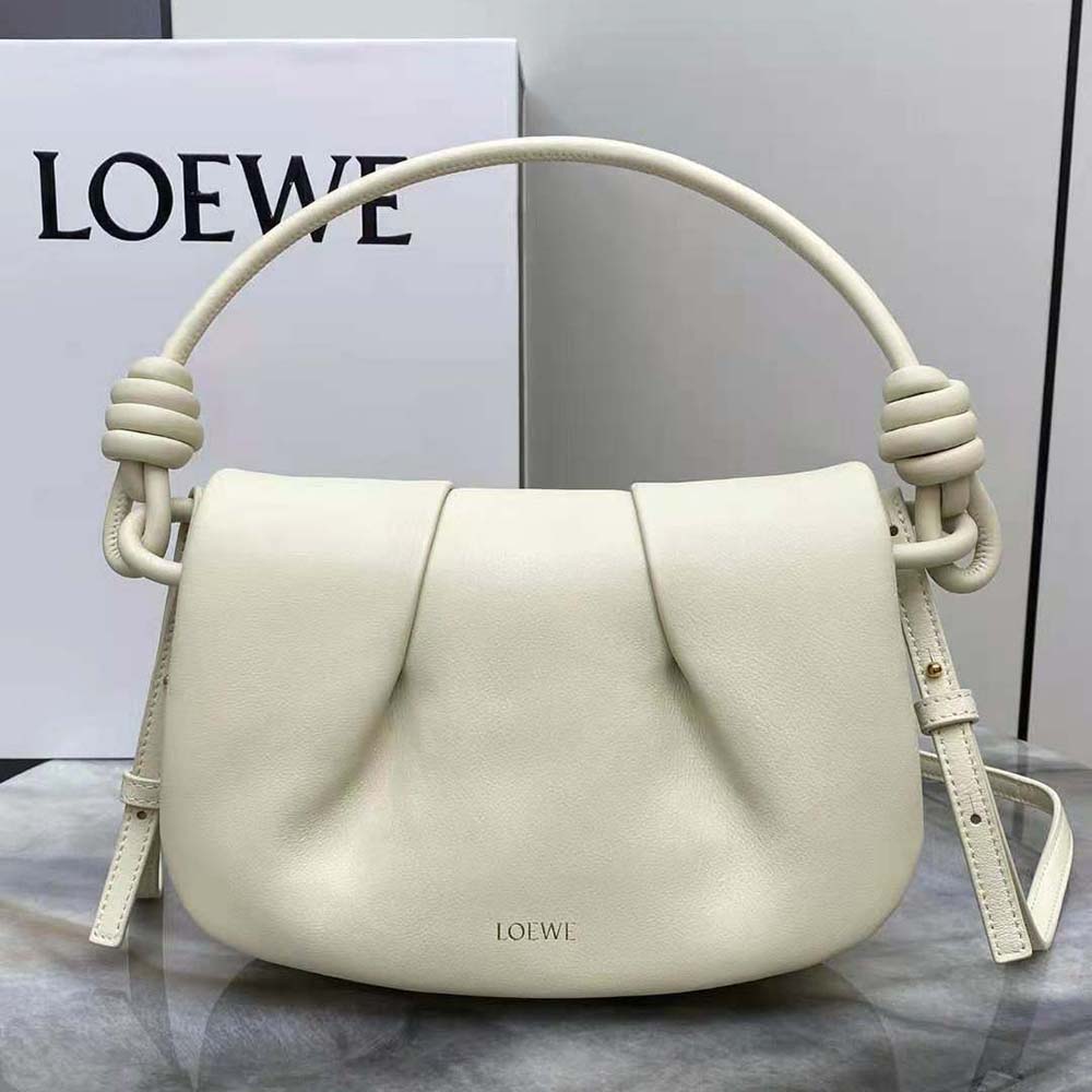 Close-up of gold-tone hardware on Loewe Women Paseo Satchel white bag