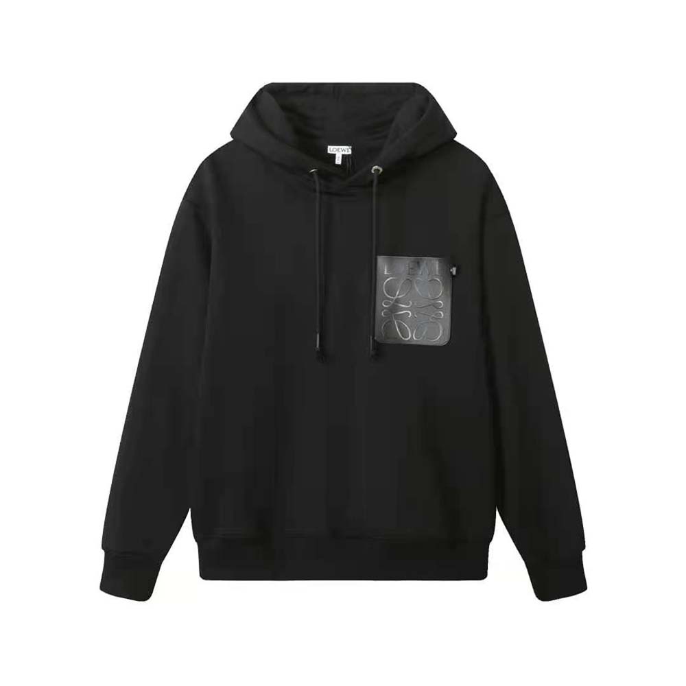 Close-up of embossed Loewe logo on black cotton hoodie