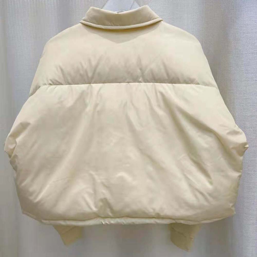 Side profile showing silhouette of Miu Miu Women Cropped Technical Fabric Down Jacket