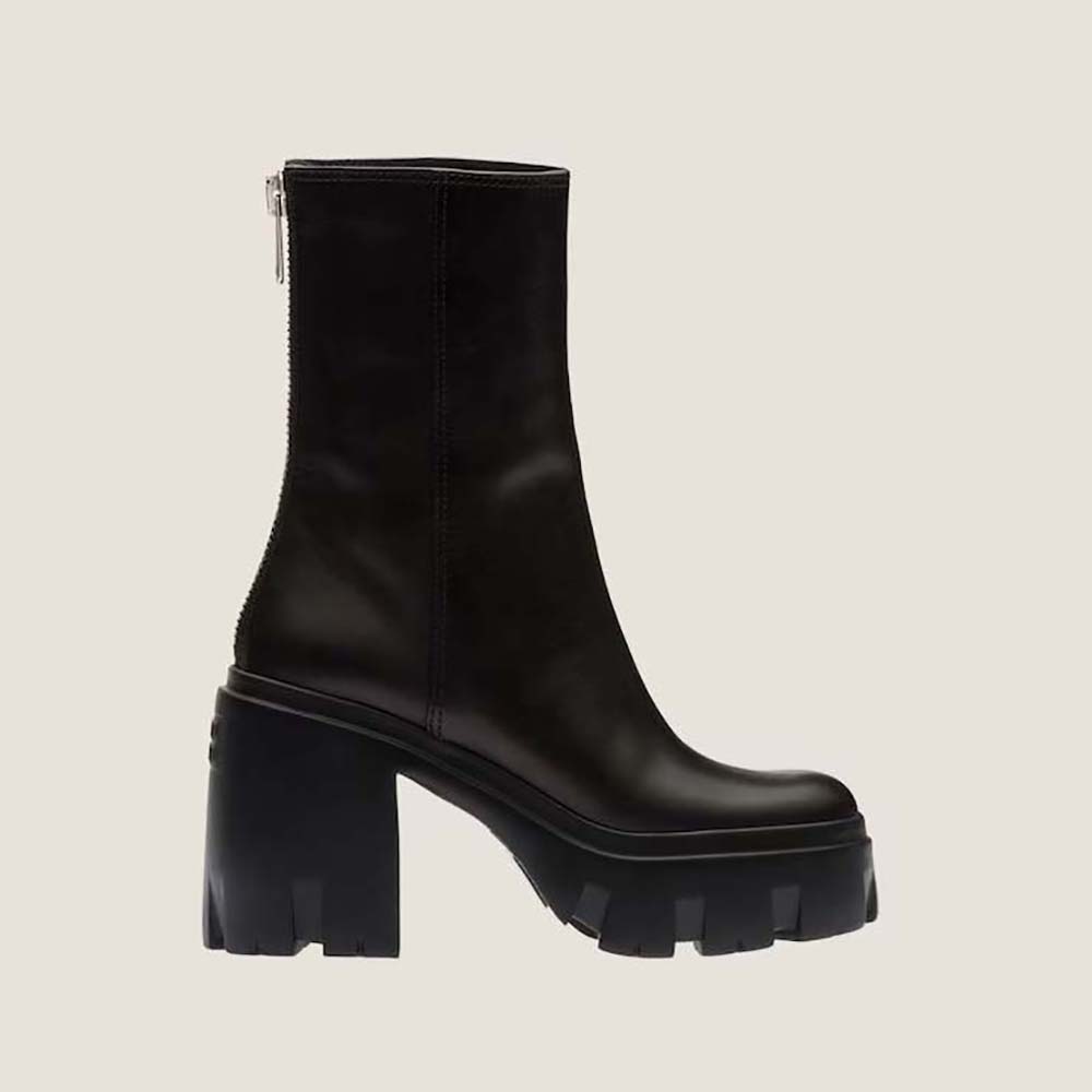 Side view of Miu Miu Women Leather Booties in EVA Sole with Logo