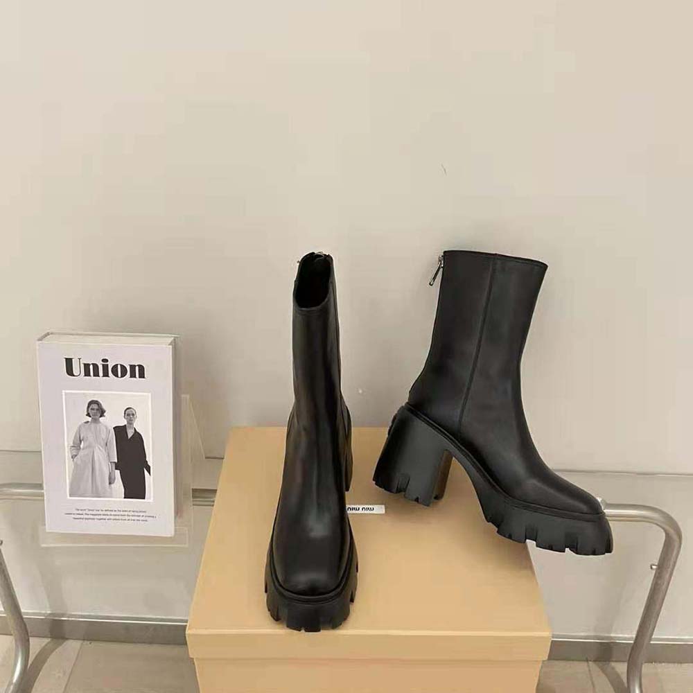 Top-down angle showing elastic side panels on Miu Miu booties