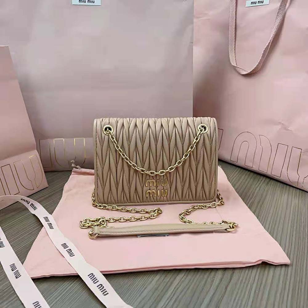 Close-up of gold-tone hardware and sandy nappa leather on Miu Miu mini-bag