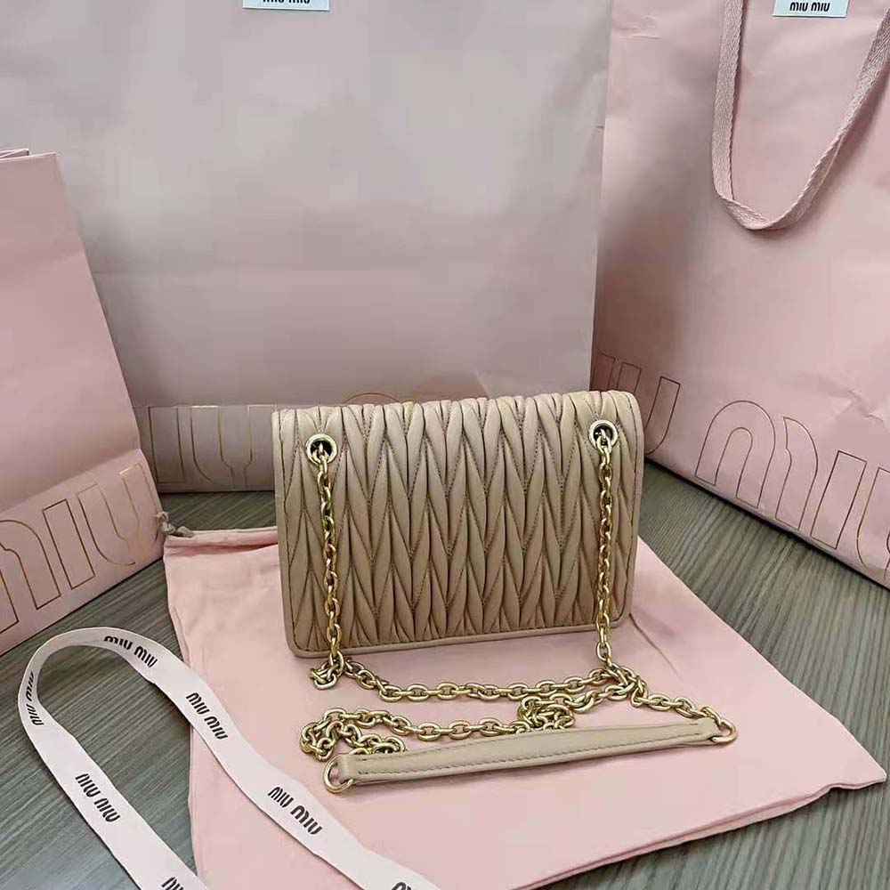 Side angle of Miu Miu Women Matelassé Nappa Leather Mini-bag-Sandy with adjustable strap