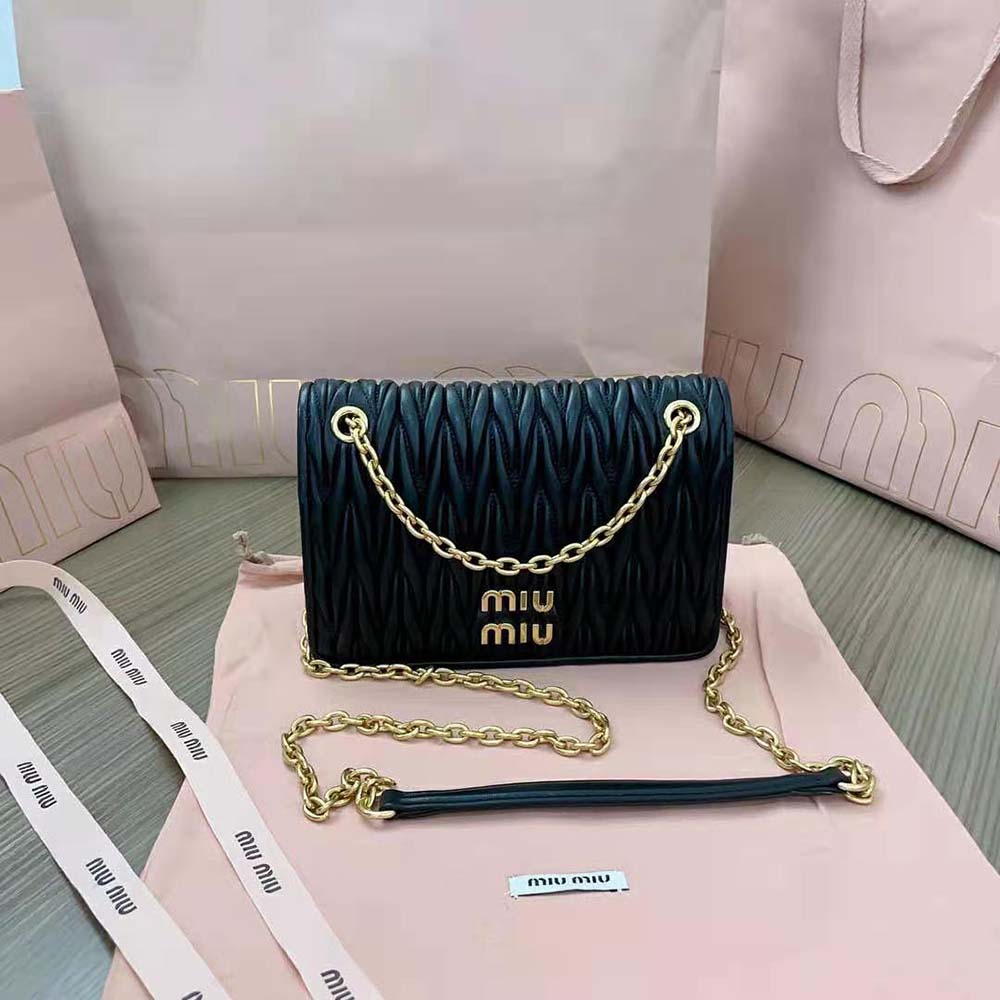Close-up of matelassé quilting on Miu Miu mini-bag in black
