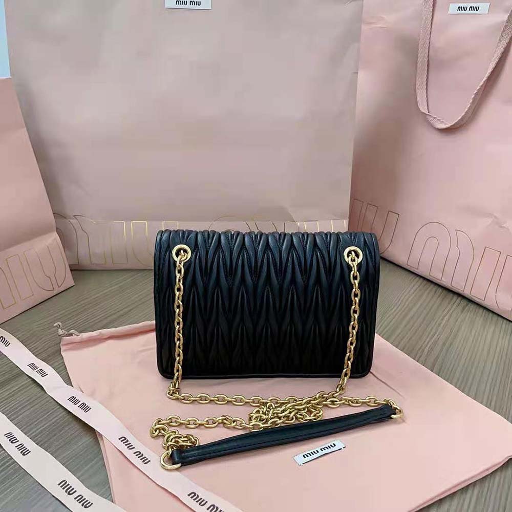 Side angle showing silver hardware on Miu Miu Nappa leather mini-bag