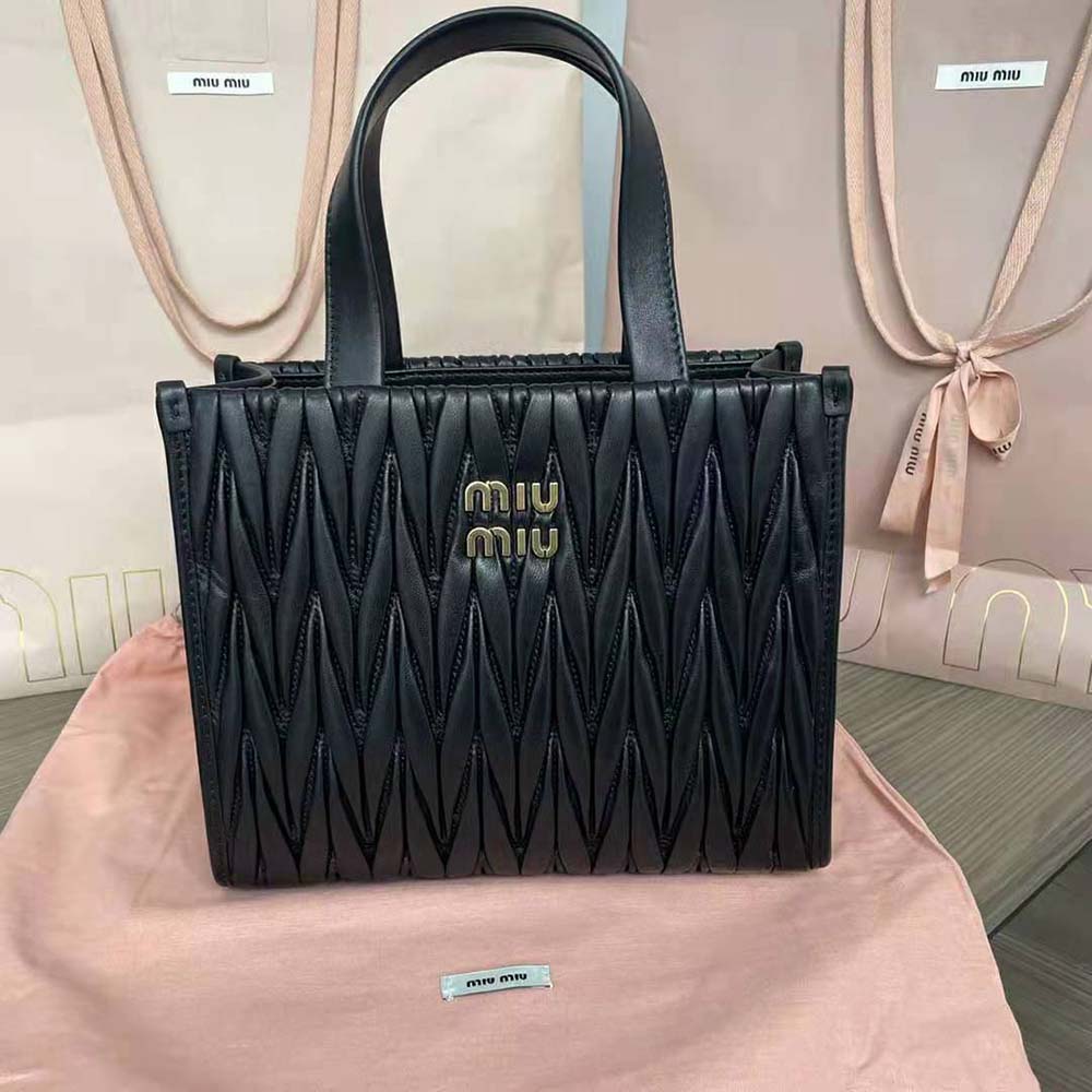 Close-up detail of gold hardware on Miu Miu Women Matelassé Nappa Leather Tote-Black