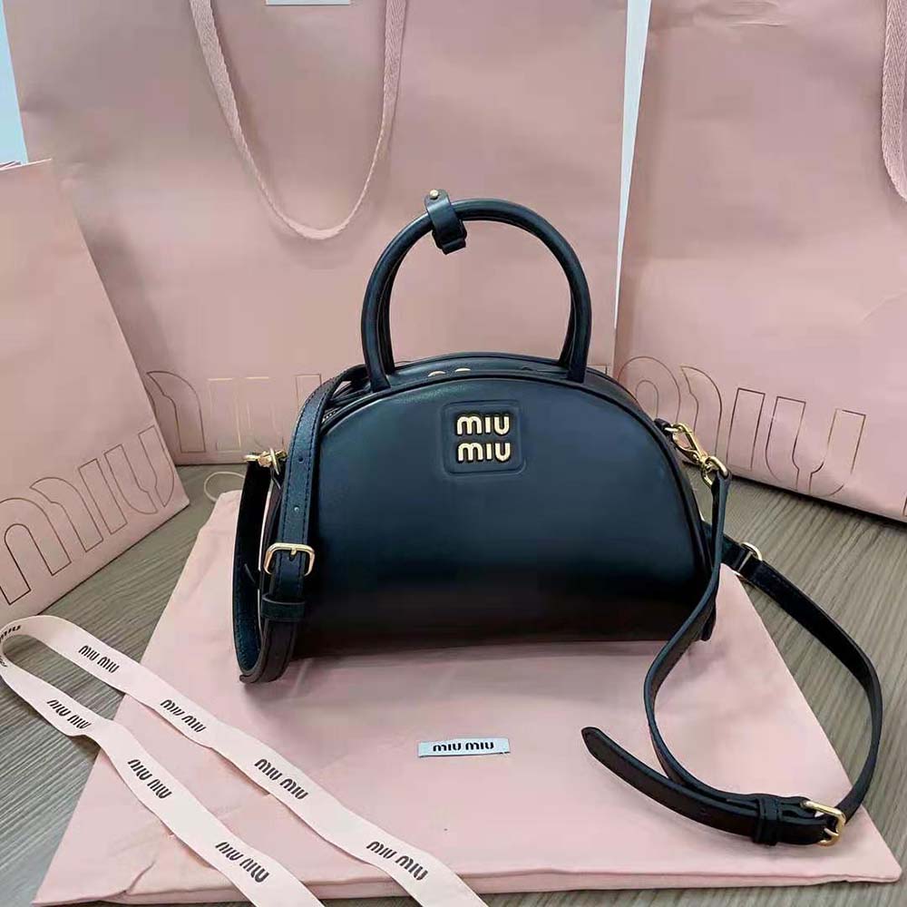 Side angle showing silhouette of Miu Miu Medium Leather Top-handle Bag-Black