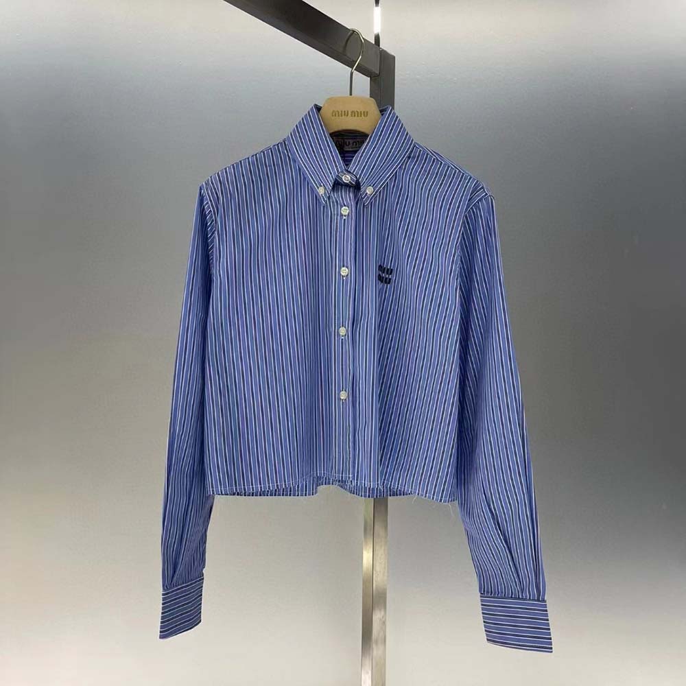 Close-up detail of embroidered logo on blue Miu Miu Women Poplin Shirt