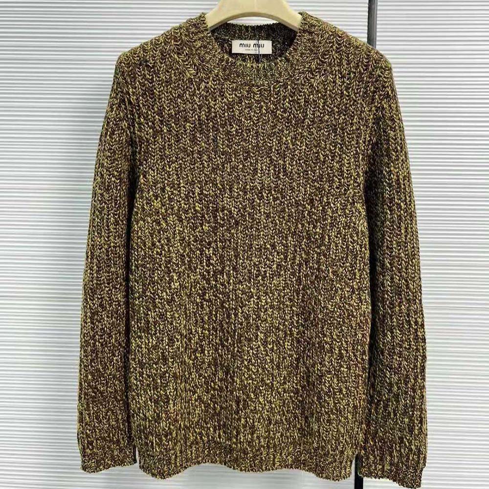 Close-up of knit logo patch on green Miu Miu sweater