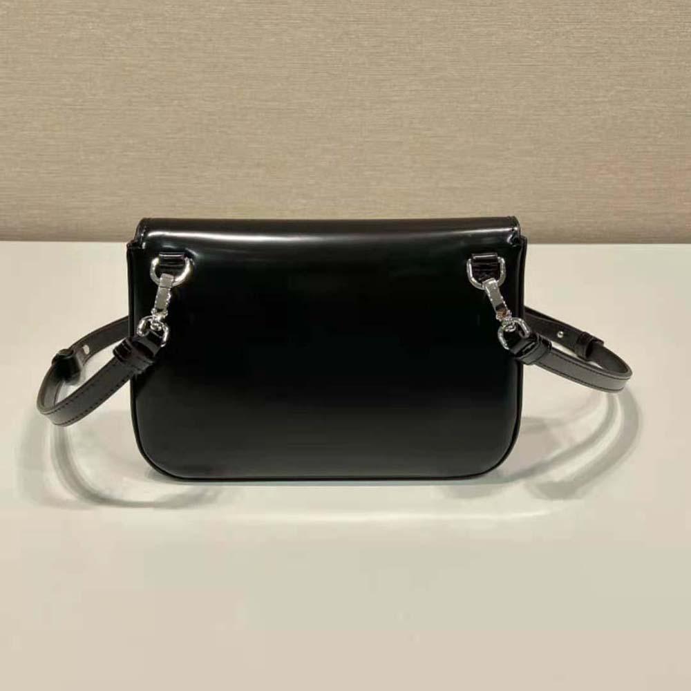 Side angle showing adjustable shoulder strap on Prada mini-bag black