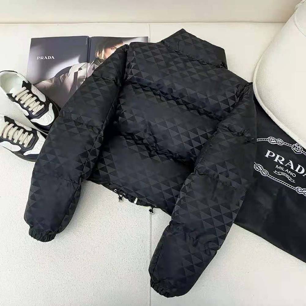 Side angle showing cropped silhouette and hood detail of Prada jacket