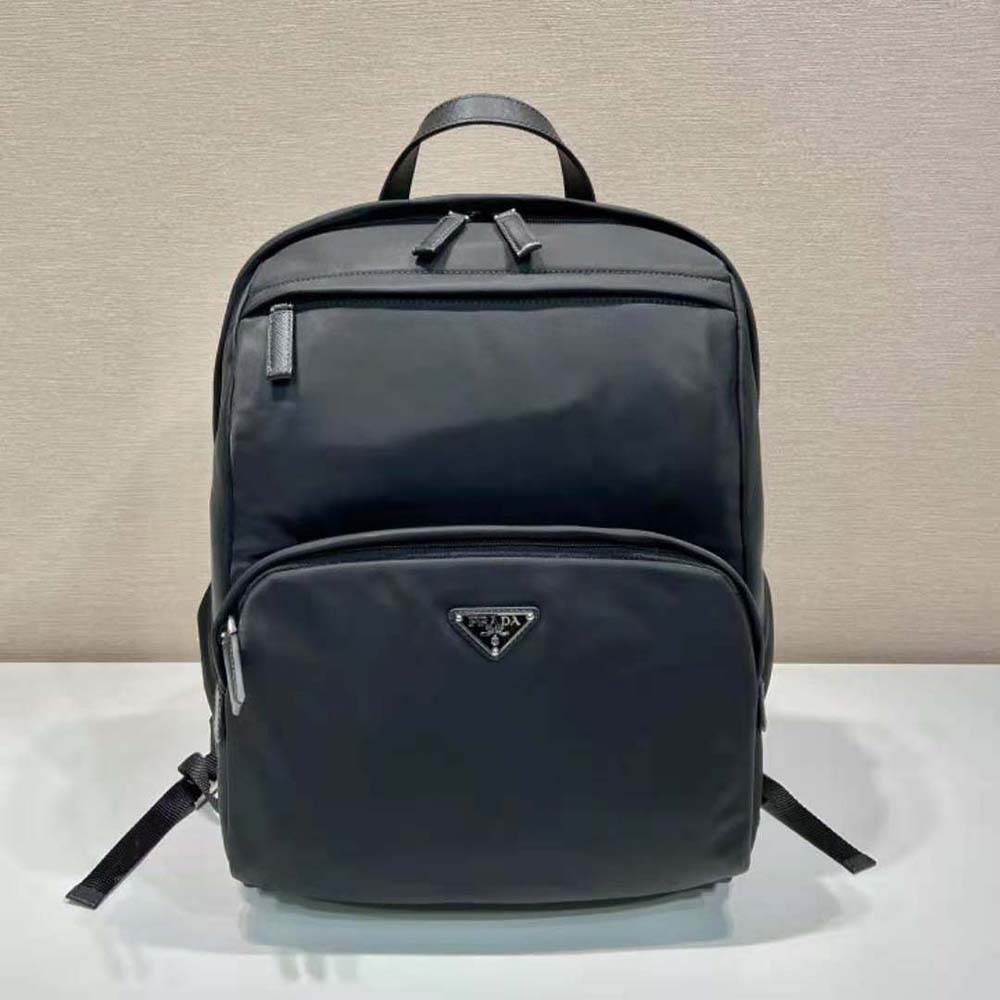 Close-up of saffiano leather detail and silver hardware on Prada backpack