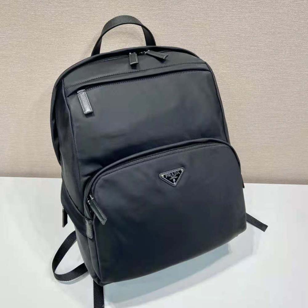 Side angle showing shape and adjustable straps of Prada Men Re-Nylon Backpack