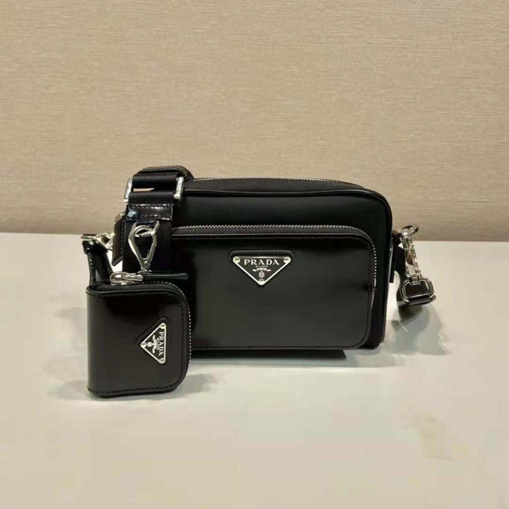 Side angle showing adjustable strap and silhouette on Prada black bag